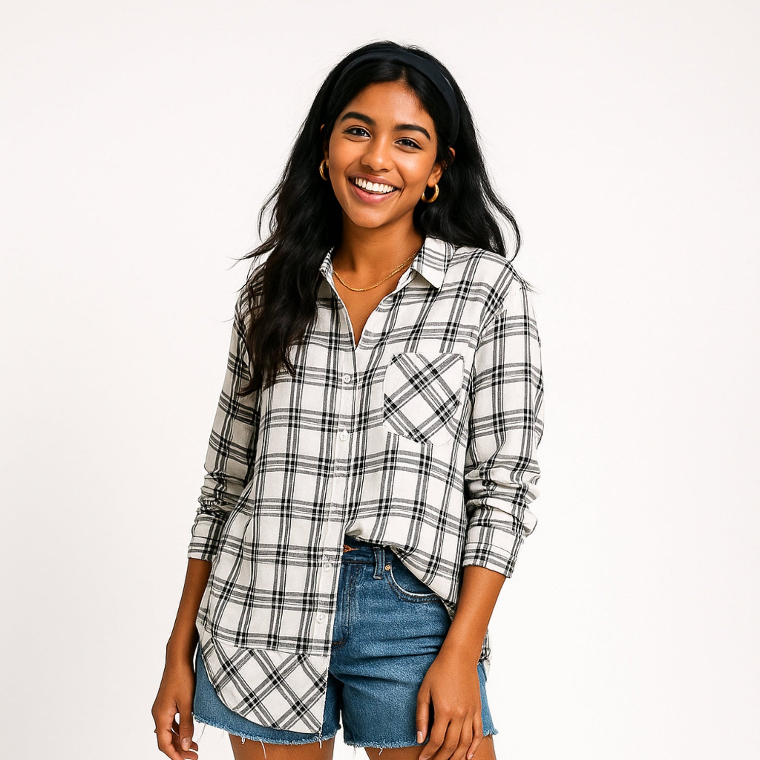 Woman wearing a red and black plaid shirt, showcasing a thrifted, stylish look from the Plaids for Women collection.