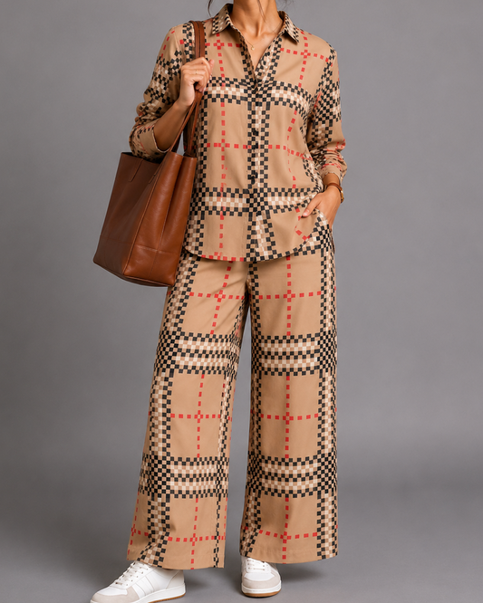 Woman wearing a plaid outfit with a brown bag on a gray background