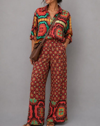 Woman wearing a colorful patterned outfit with a gray background
