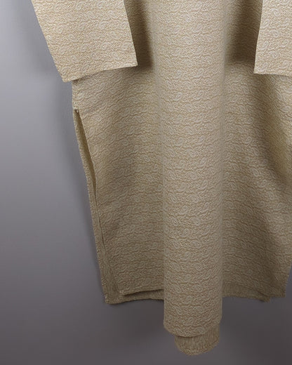 men's beige kurta with self pattern in fabric - zoomed view with focus on hemline