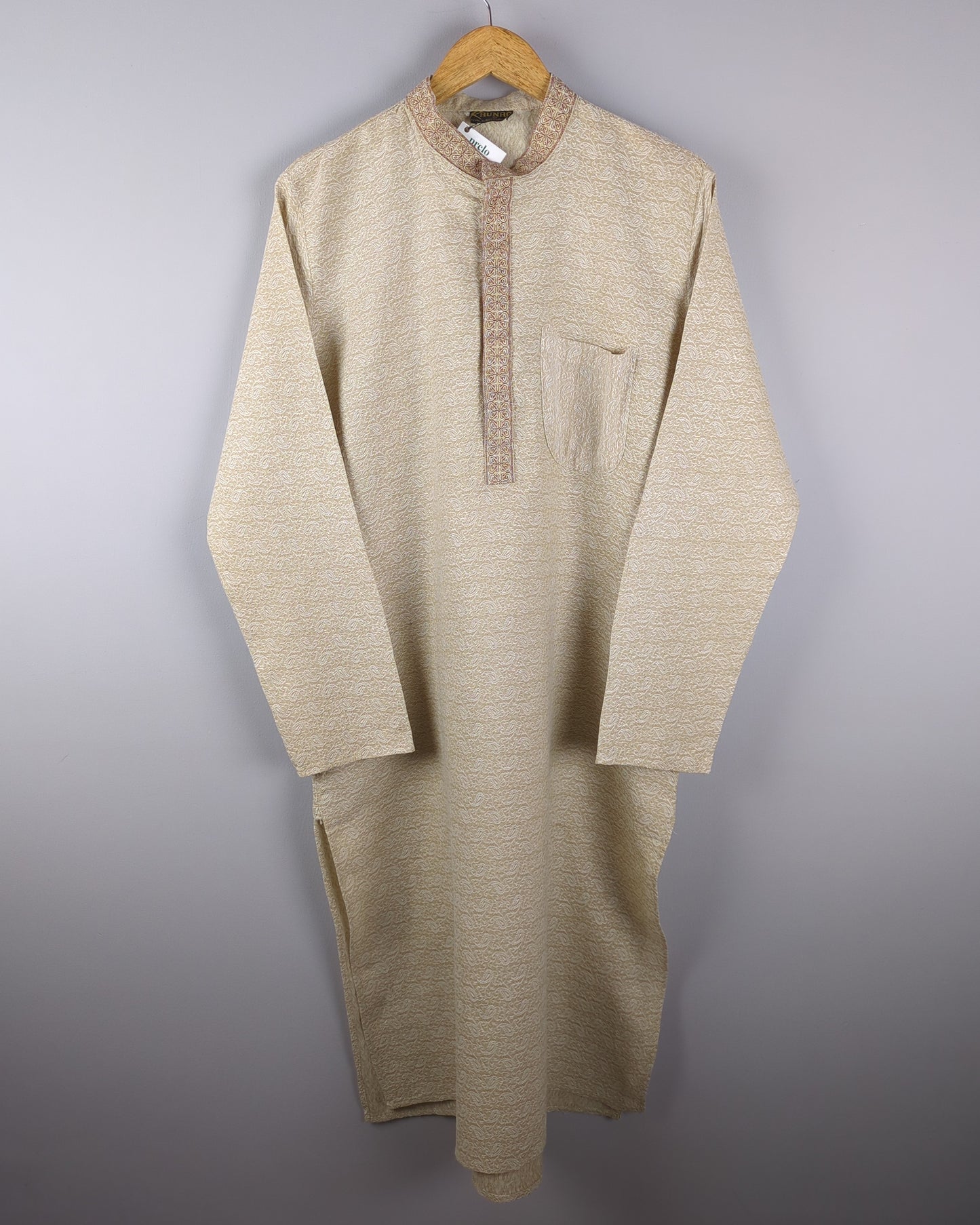 men's beige kurta with self pattern in fabric front side of the kurta