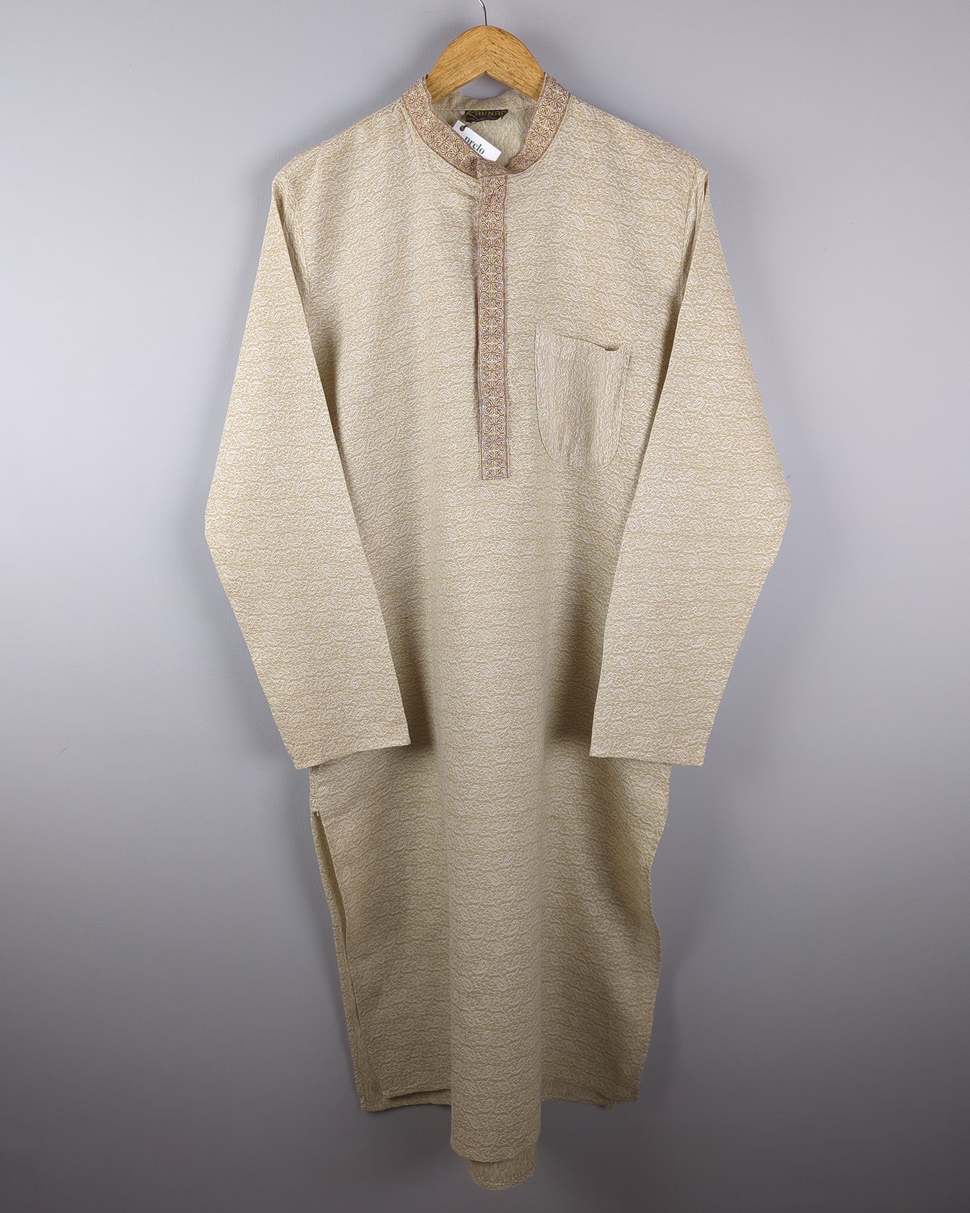 men's beige kurta with self pattern in fabric front side of the kurta