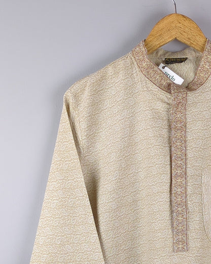 men's beige kurta with self pattern in fabric - zoomed view with focus on neckline and shoulder