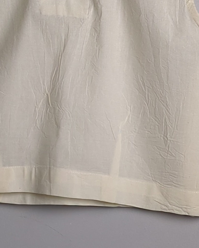 White Sleeveless Blouse